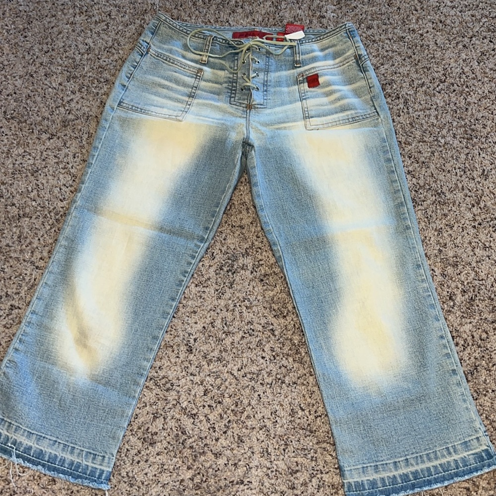 Vintage Y2K low rise lace up crop jeans.